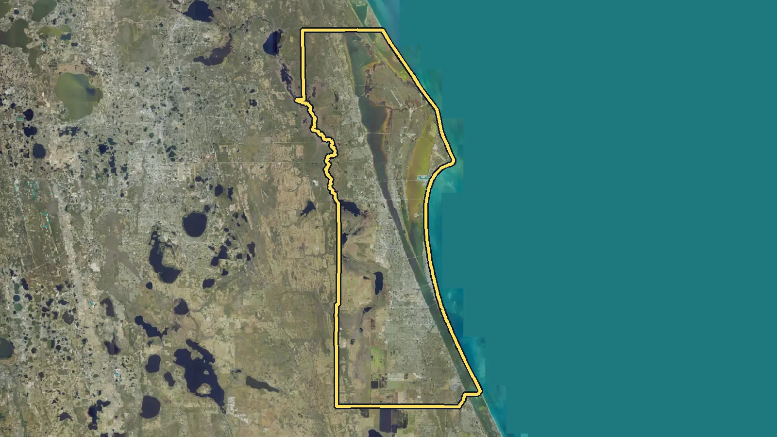 Aerial photo of Brevard County, Florida, with the county's outline drawn on it