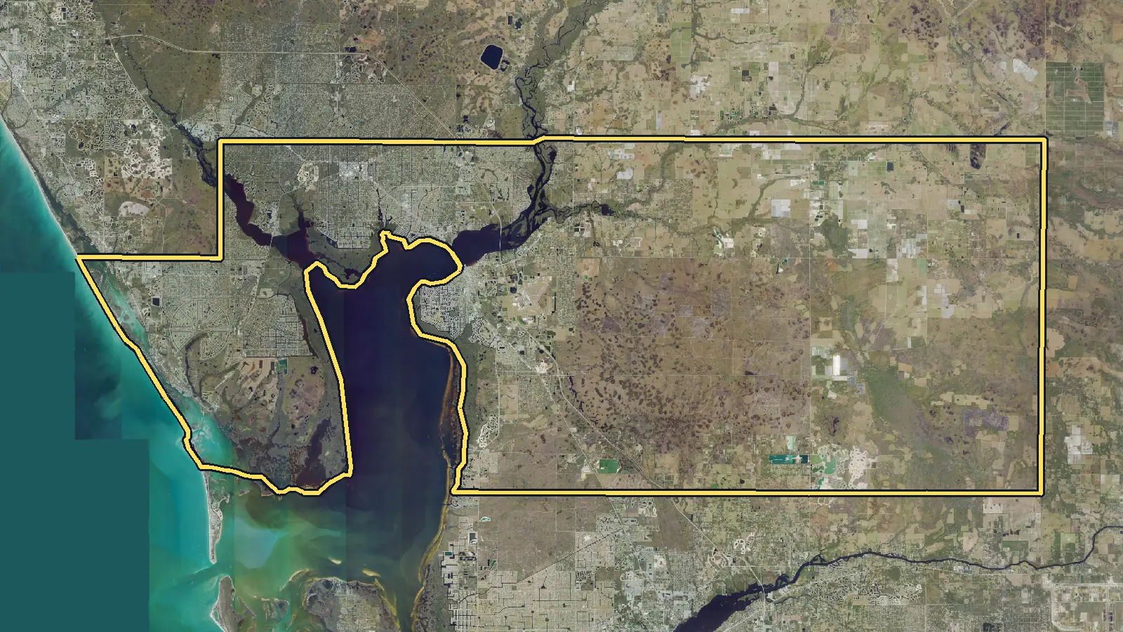 Aerial photo of Charlotte County, Florida, with the county's outline drawn on it