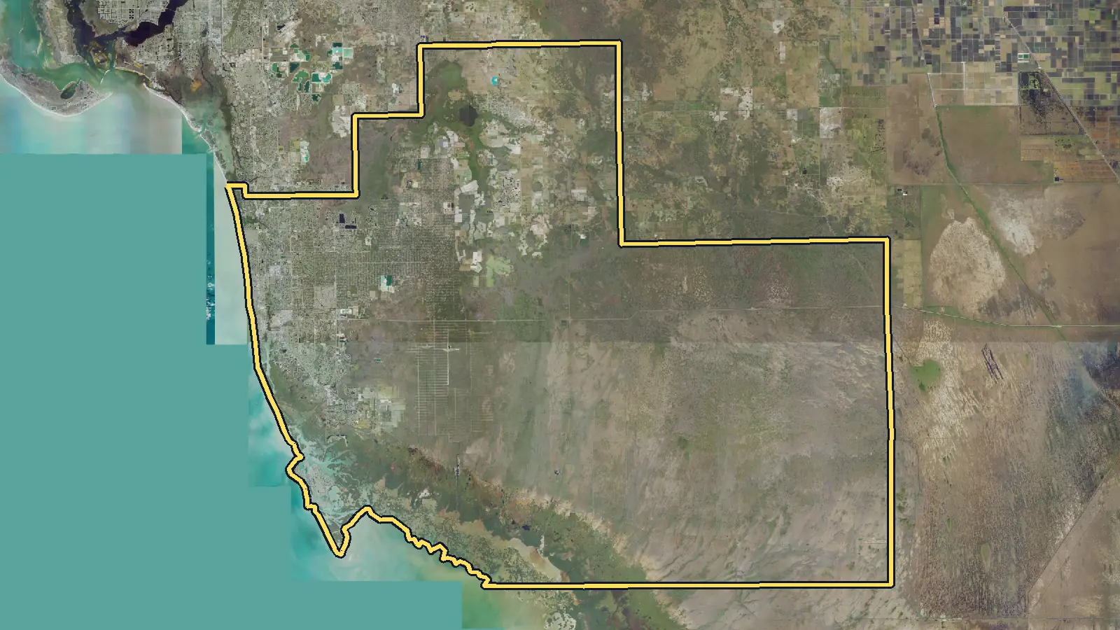 Aerial photo of Collier County, Florida, with the county's outline drawn on it