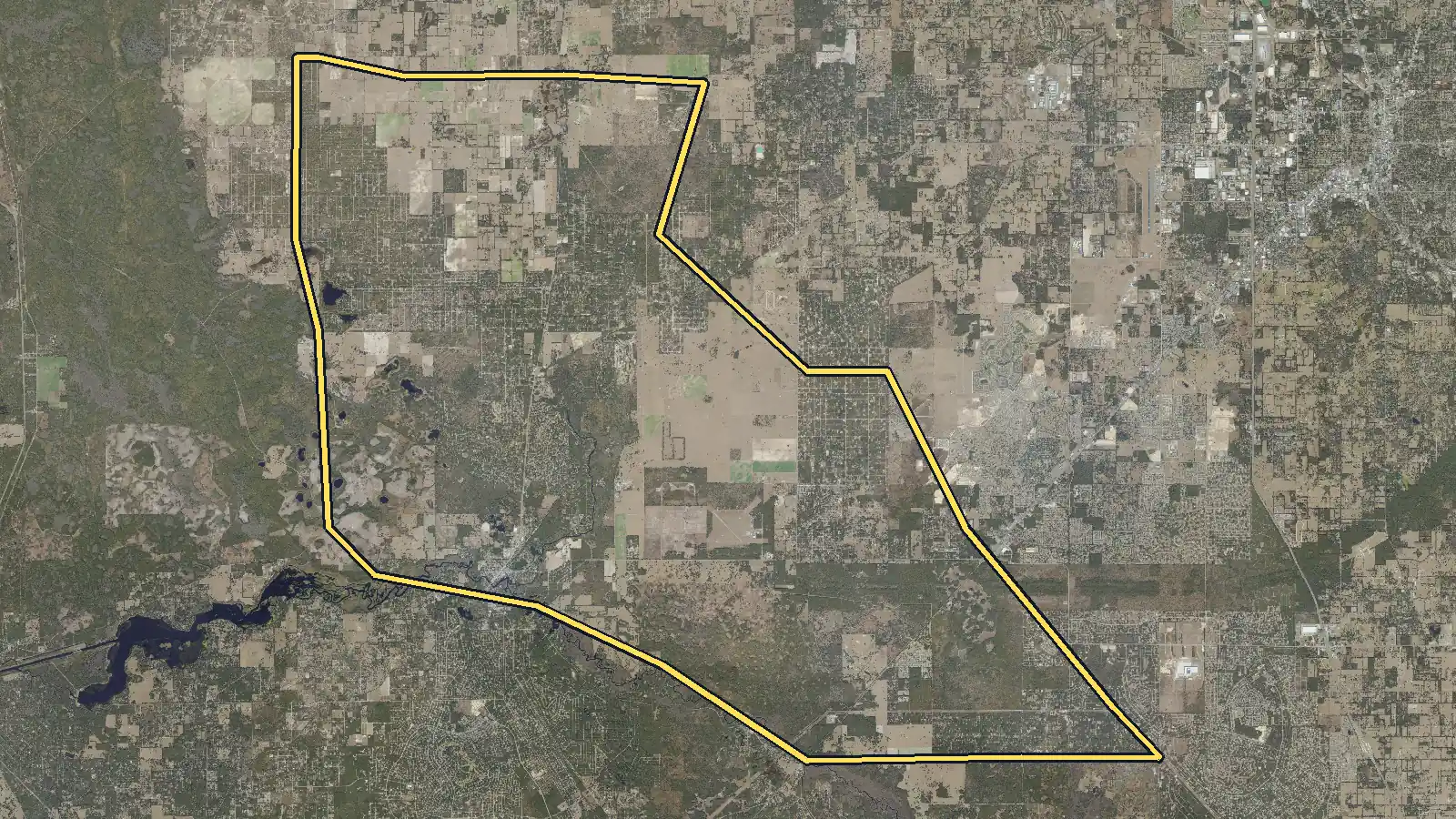Aerial photo of Dunnellon, Florida, with the community's outline drawn on it