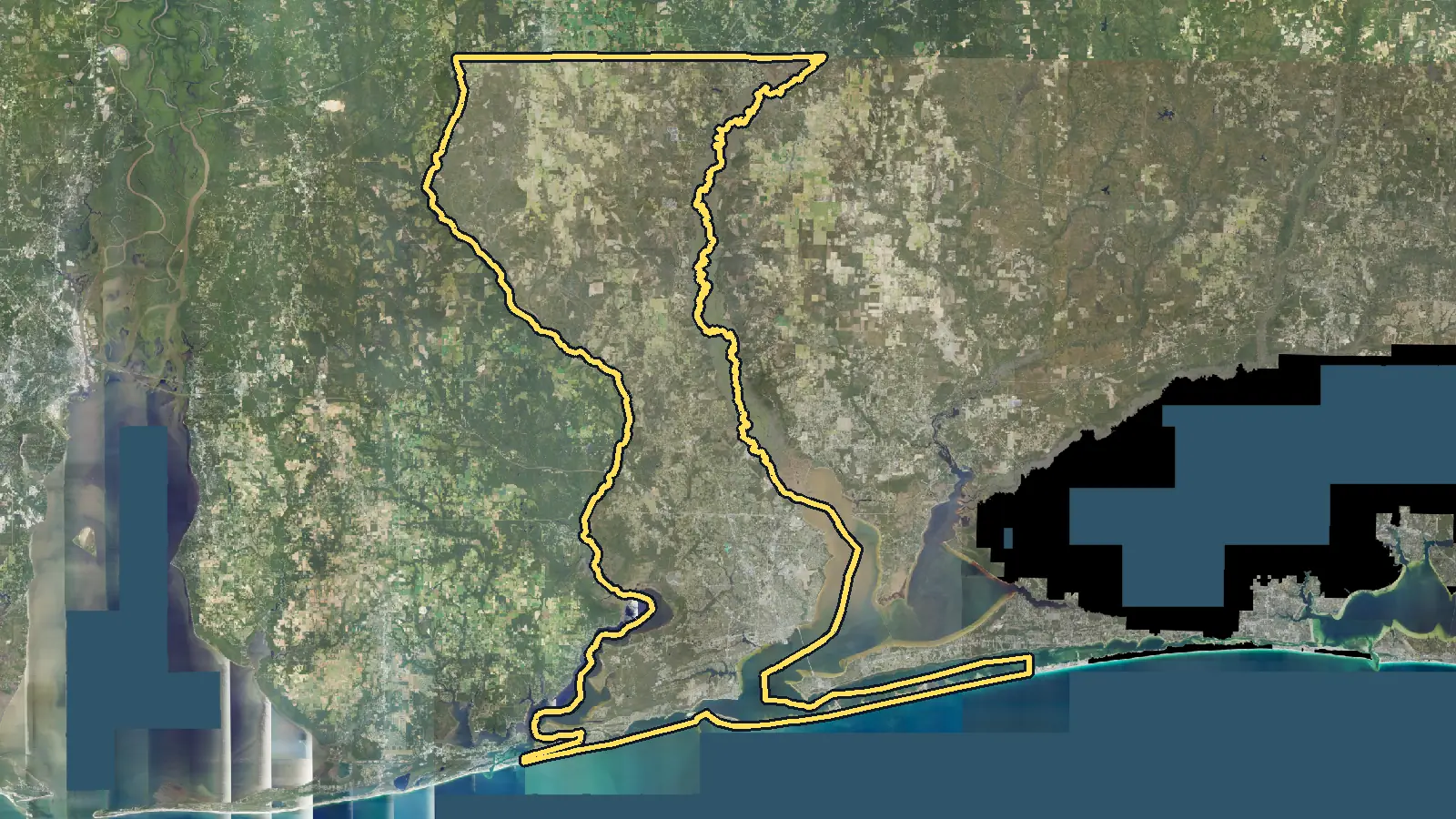 Aerial photo of Escambia County, Florida, with the county's outline drawn on it