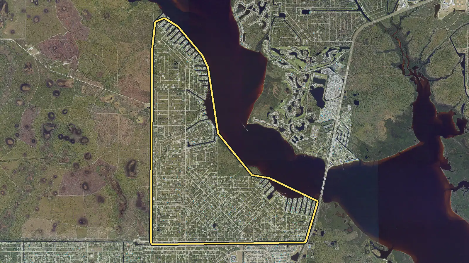 Aerial photo of Gulf Cove, Florida, with the community's outline drawn on it