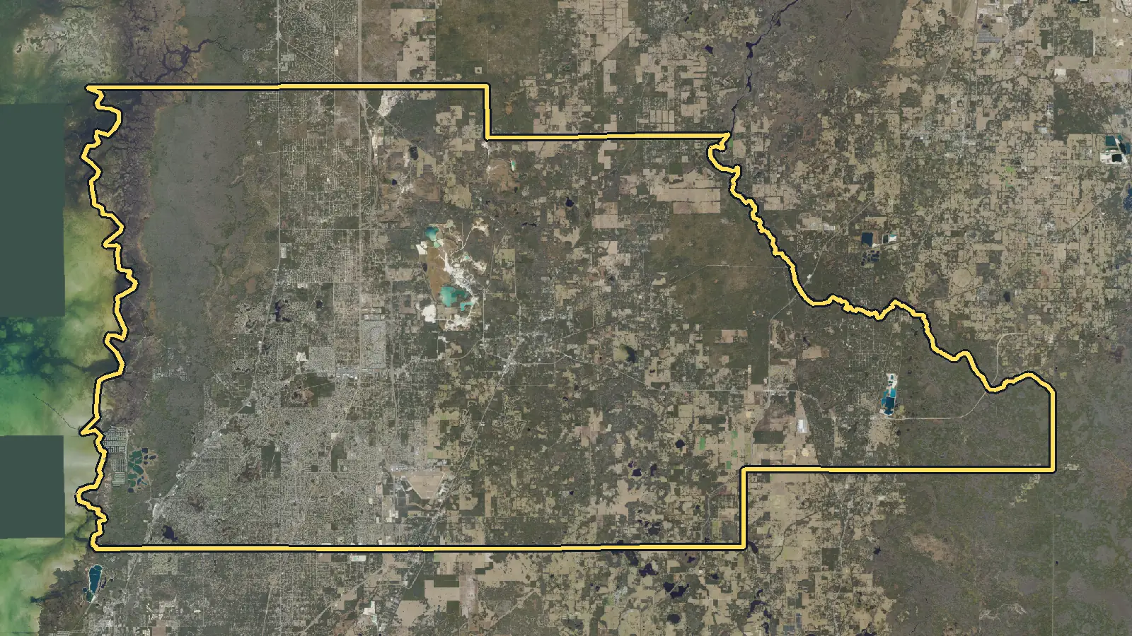 Aerial photo of Hernando County, Florida, with the county's outline drawn on it
