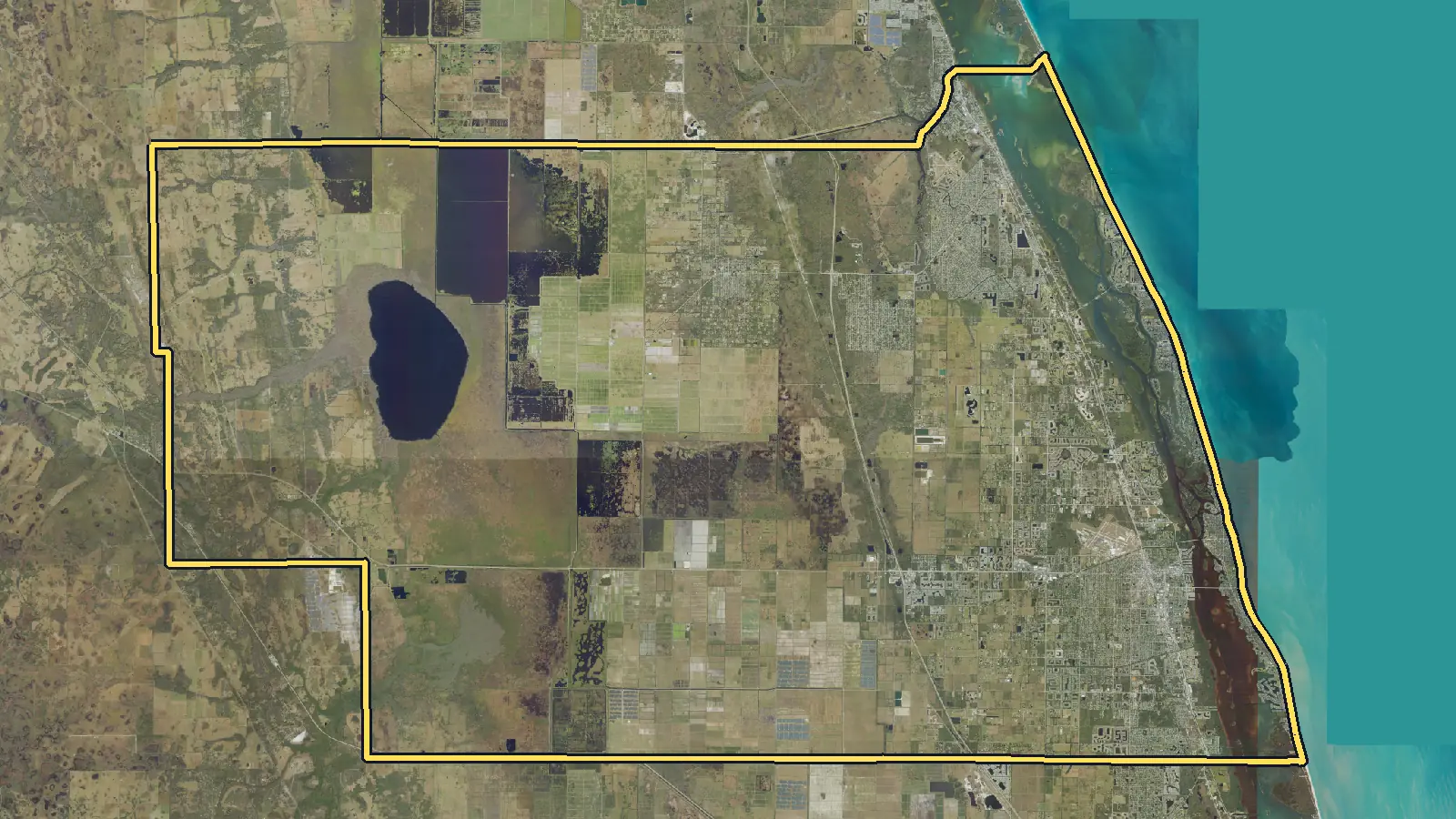 Aerial photo of Indian River County, Florida, with the county's outline drawn on it