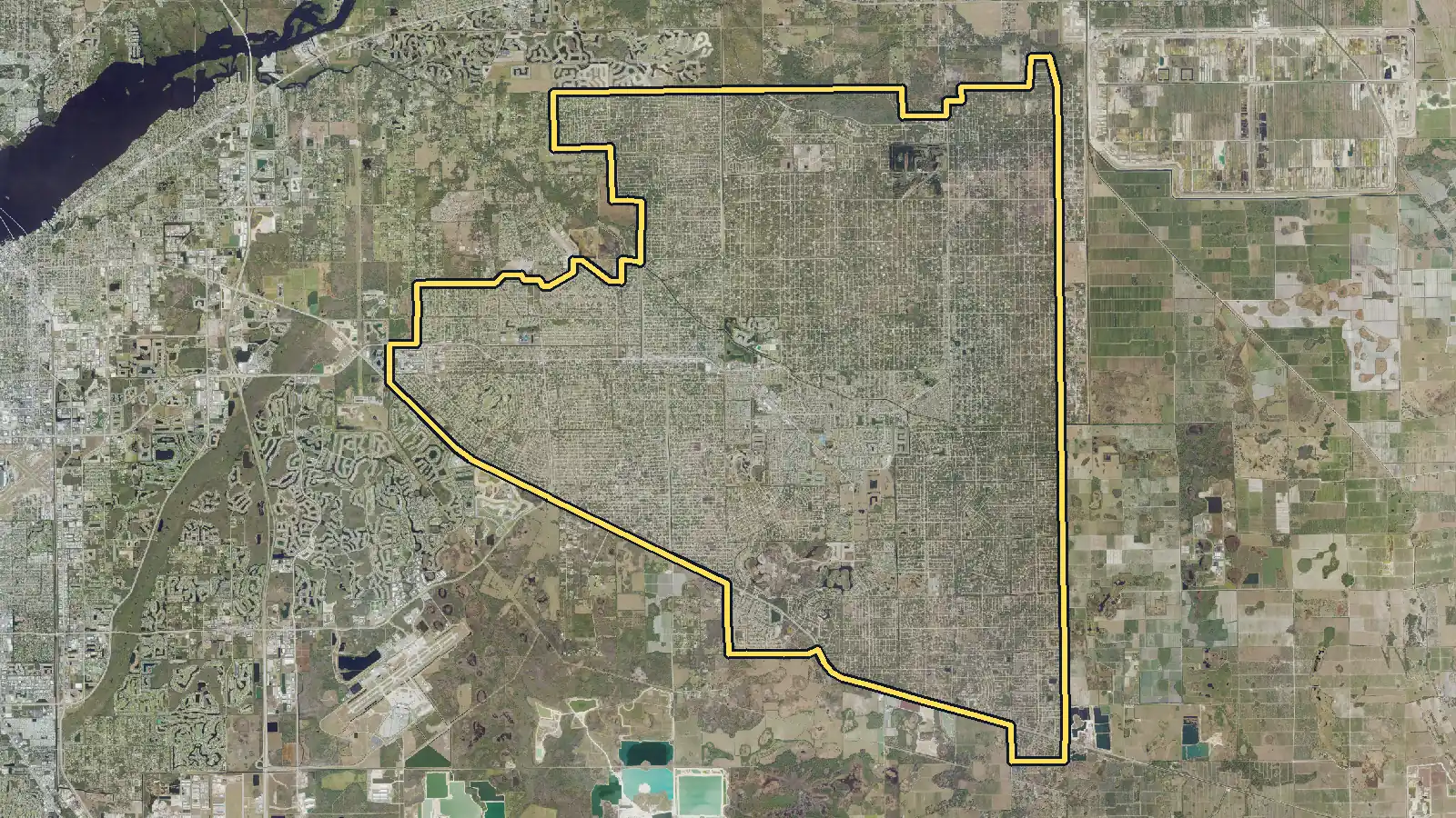 Aerial photo of Lehigh Acres, Florida, with the community's outline drawn on it