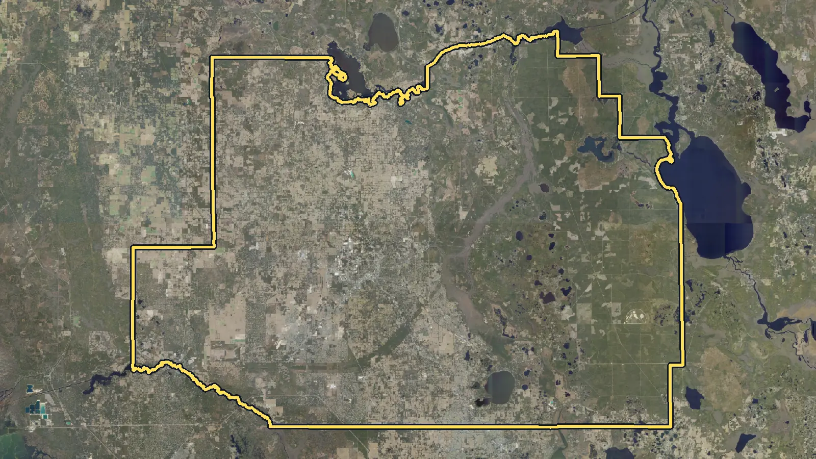 Aerial photo of Marion County, Florida, with the county's outline drawn on it