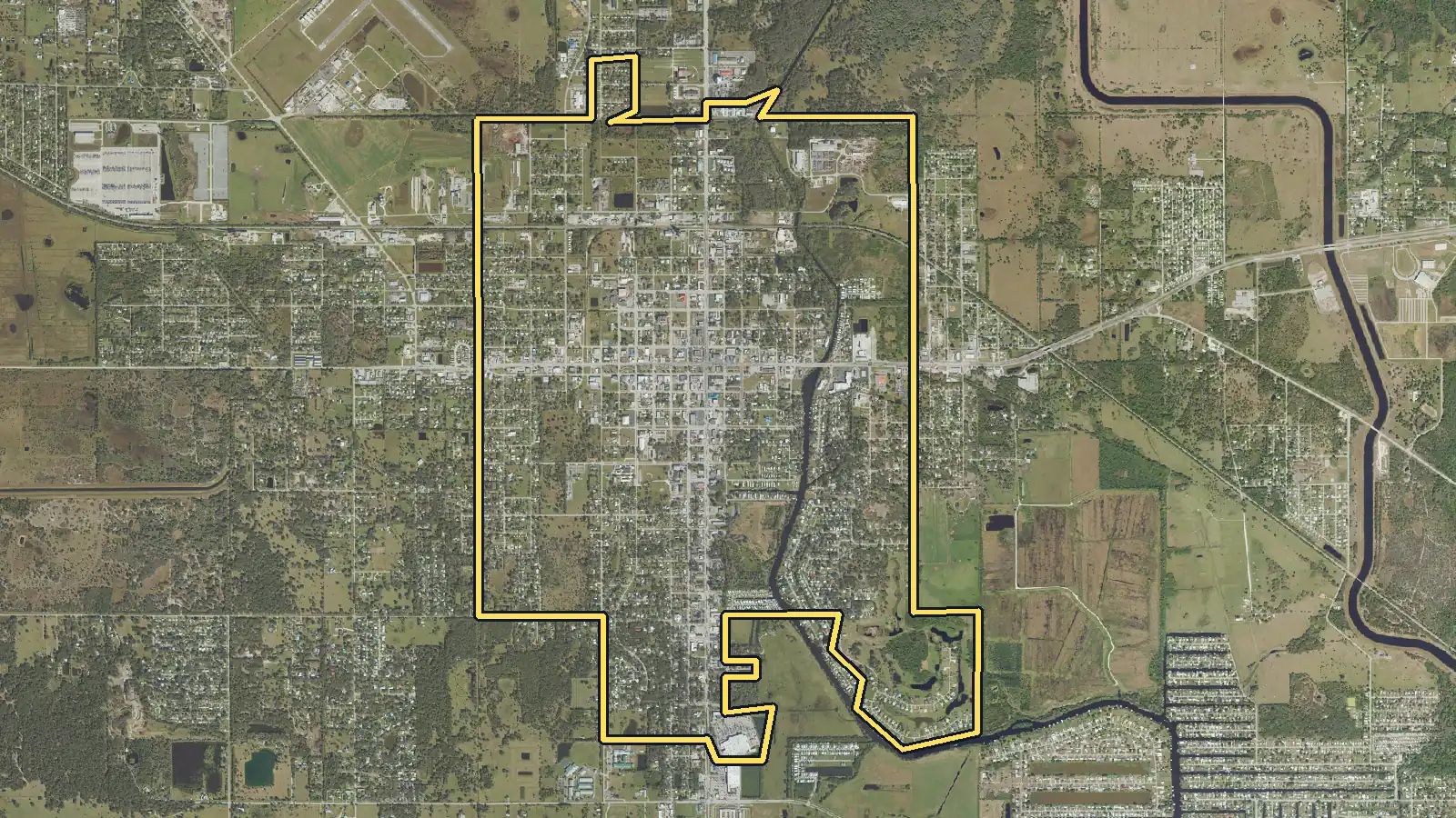 Aerial photo of Okeechobee, Florida, with the community's outline drawn on it