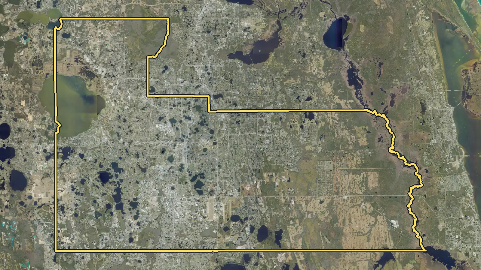 Aerial photo of Orange County, Florida, with the county's outline drawn on it