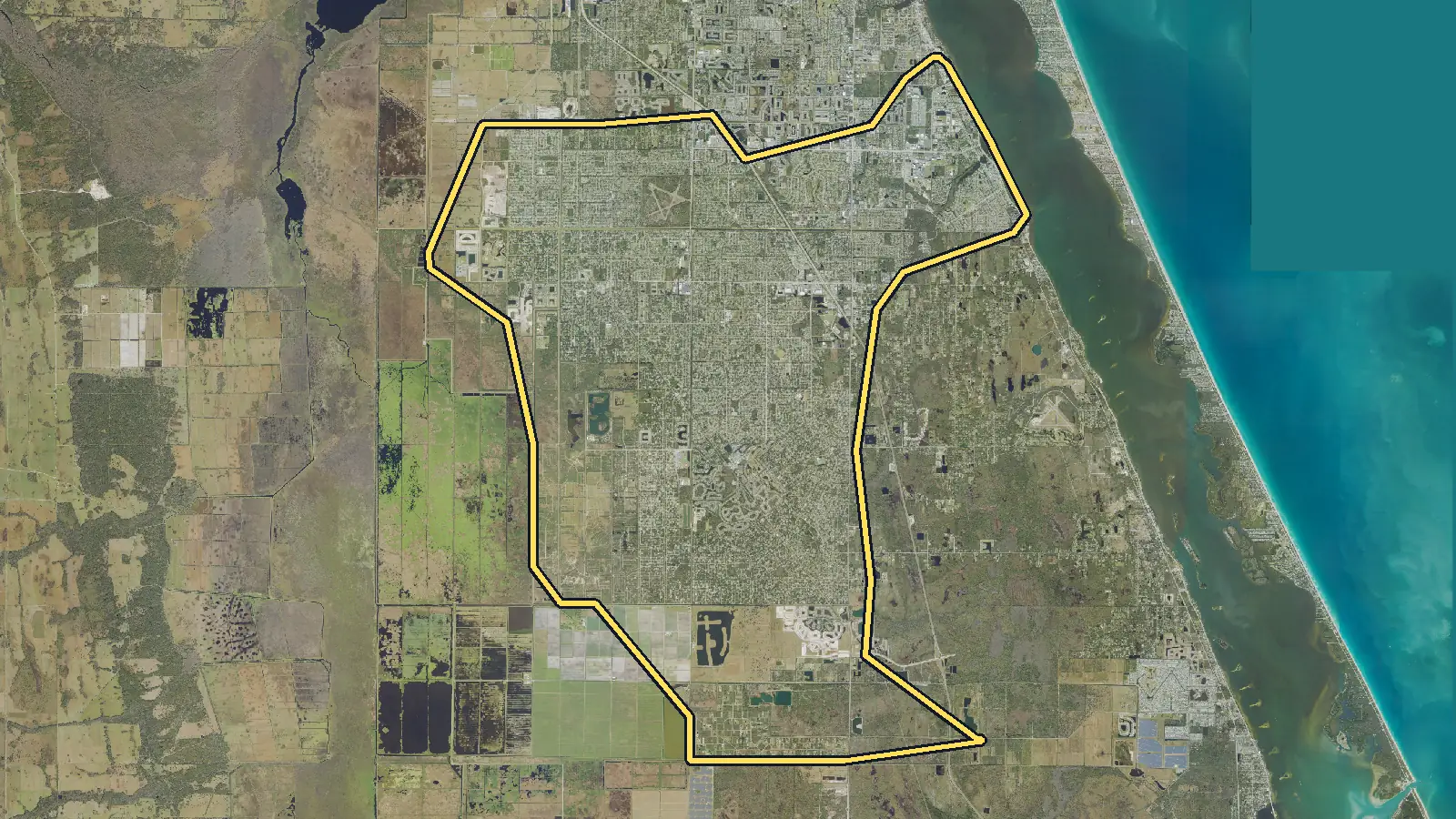 Aerial photo of Palm Bay, Florida, with the community's outline drawn on it