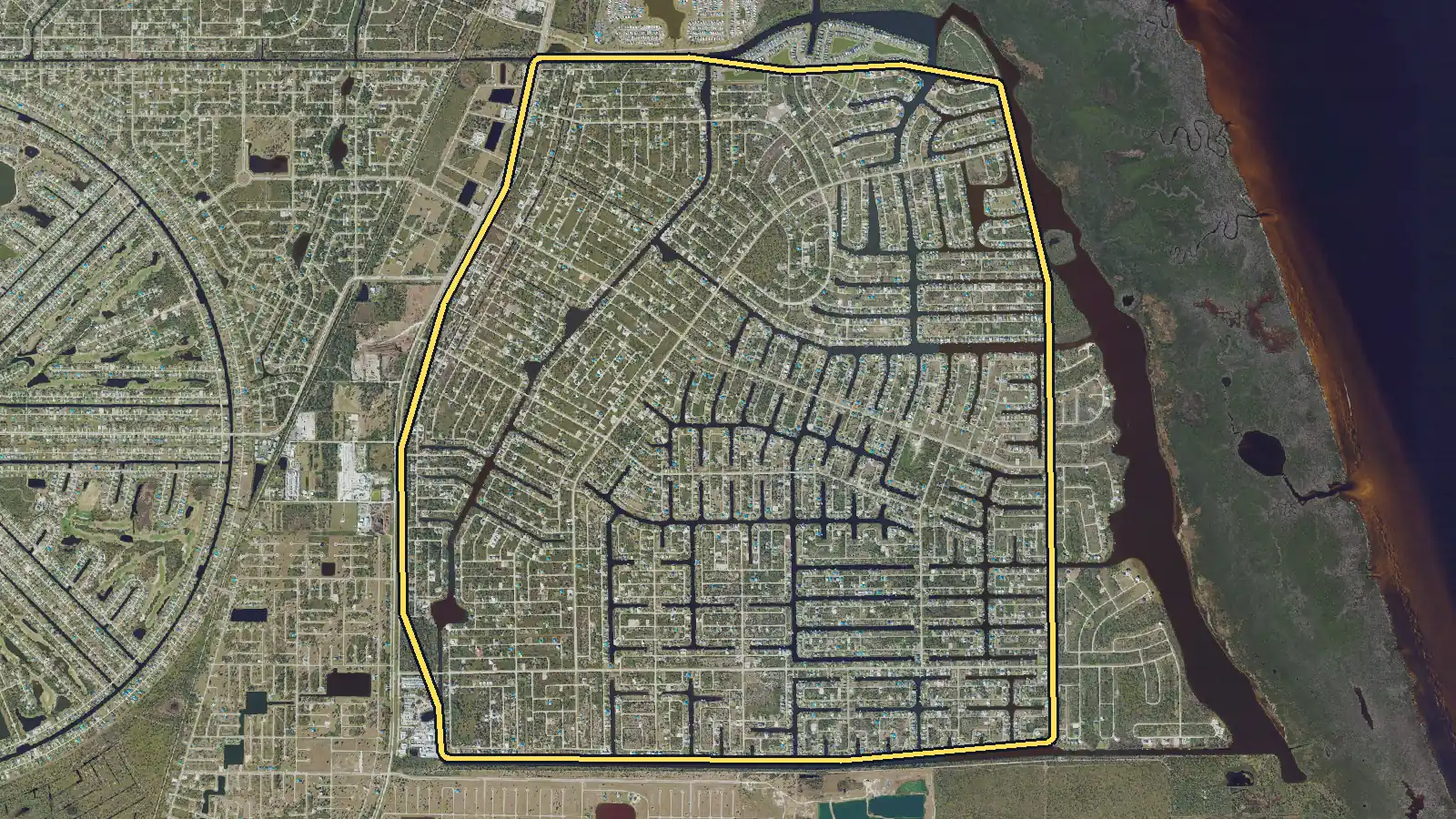 Aerial photo of South Gulf Cove, Florida, with the community's outline drawn on it