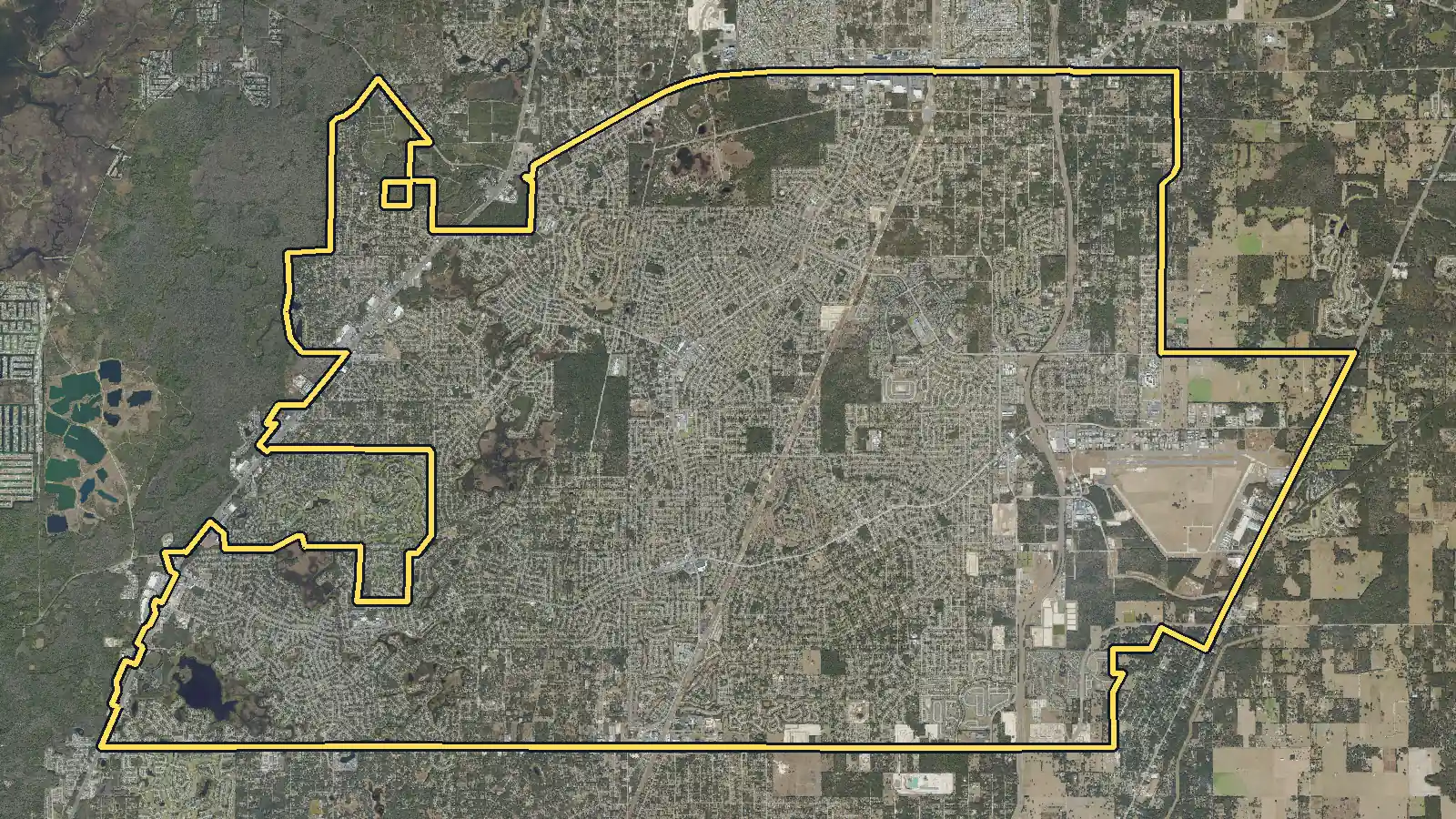 Aerial photo of Spring Hill, Florida, with the community's outline drawn on it
