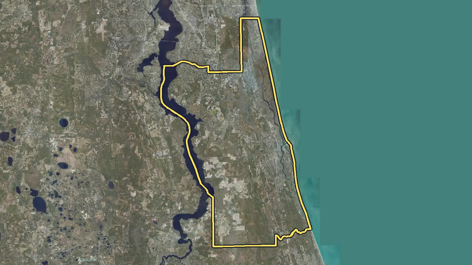 Aerial photo of St. Johns County, Florida, with the county's outline drawn on it
