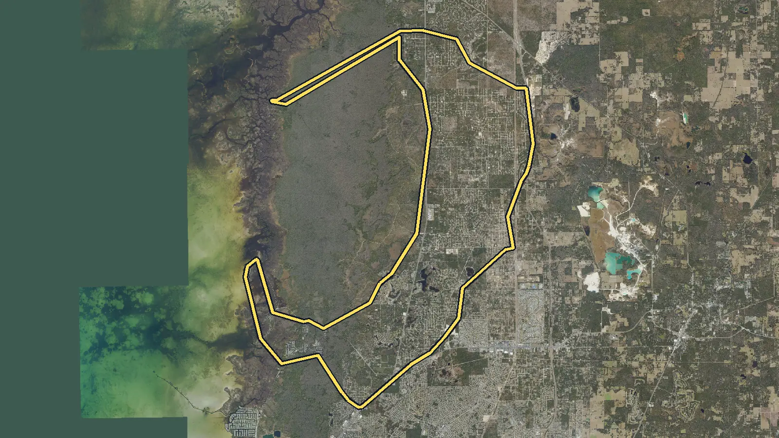 Aerial photo of Weeki Wachee, Florida, with the community's outline drawn on it
